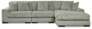 Ashley Furniture Lindyn sectional with chaise, featuring plush fabric, modern design, and spacious seating in a neutral color.