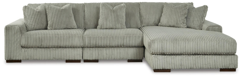 Ashley Furniture Lindyn sectional with chaise, featuring plush fabric, modern design, and spacious seating in a neutral color.