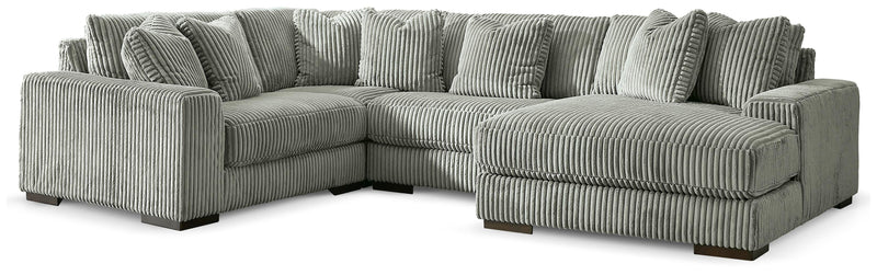 Ashley Furniture Lindyn sectional with chaise, showing a modern fabric sofa with multiple cushions and a spacious design