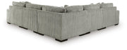 Ashley Furniture Lindyn living room set featuring a sofa and loveseat with neutral fabric upholstery and decorative pillows.