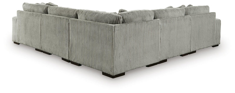 Ashley Furniture Lindyn living room set featuring a sofa and loveseat with neutral fabric upholstery and decorative pillows.