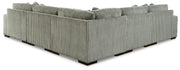 Ashley Furniture Lindyn sectional with plush fabric and multiple cushions, shown from the back in a spacious living room setting.