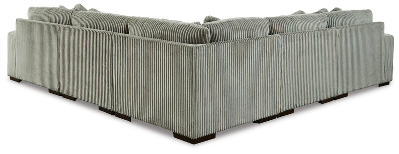 Ashley Furniture Lindyn sectional with plush fabric and multiple cushions, shown from the back in a spacious living room setting.