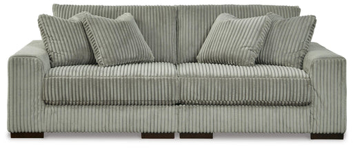 Ashley Furniture Lindyn sectional sofa with plush cushions and modern design, shown in a stylish living room setting.