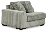 Ashley Furniture Lindyn sectional with chaise in a modern fabric, shown from an angled view highlighting the seating and chaise lounge.