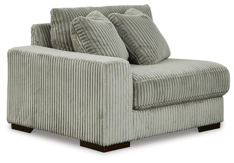 Ashley Furniture Lindyn sectional with chaise in a modern fabric, shown from an angled view highlighting the seating and chaise lounge.