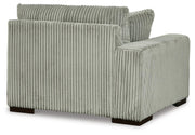 Ashley Furniture Lindyn sectional with chaise, showing plush fabric and modern design in a cozy living room setting.