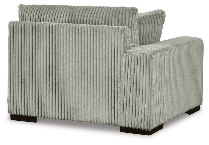 Ashley Furniture Lindyn sectional with chaise, showing plush fabric and modern design in a cozy living room setting.