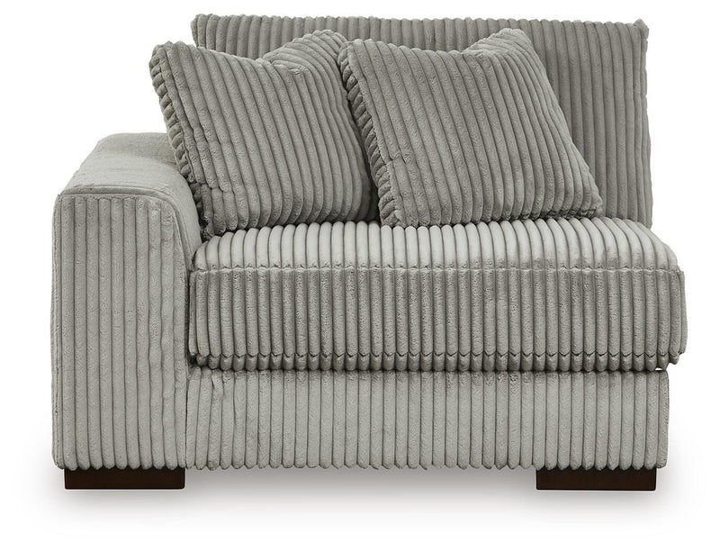 Ashley Furniture Lindyn sectional with chaise, featuring plush cushions and modern design, shown head-on from the front.