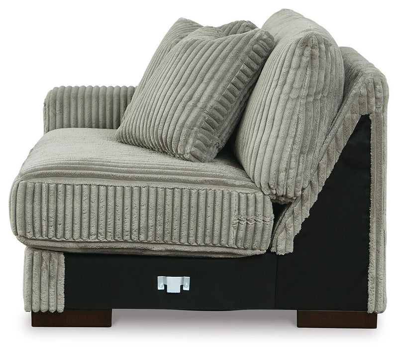 Ashley Furniture Lindyn sectional with chaise, showing plush fabric upholstery and modern living room setting.