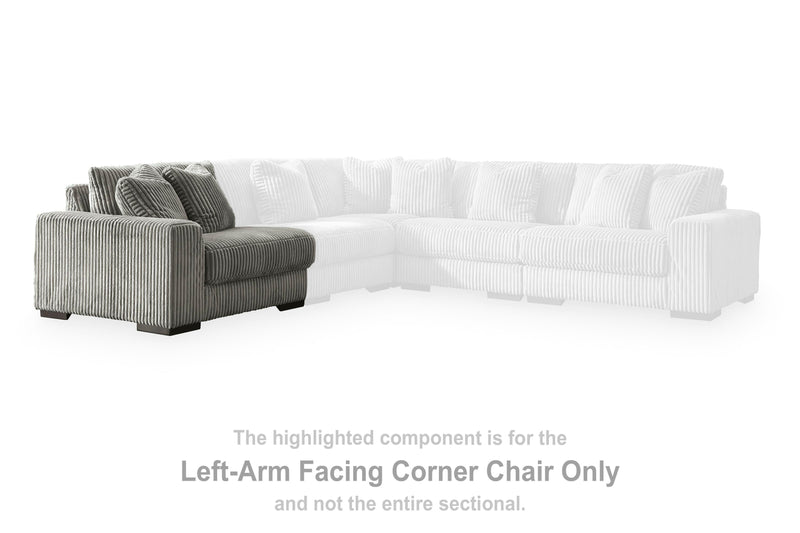 Ashley Furniture Lindyn sectional with chaise, featuring plush upholstery and modern design, shown in a cozy living room setting.