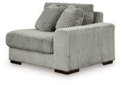 Ashley Furniture Lindyn sectional with chaise, featuring plush fabric, modern design, and multiple seating areas, shown from an angled view.