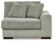 Ashley Furniture Lindyn sectional with chaise, beige fabric, modern design, showing the head-on view of the sectional and chaise.