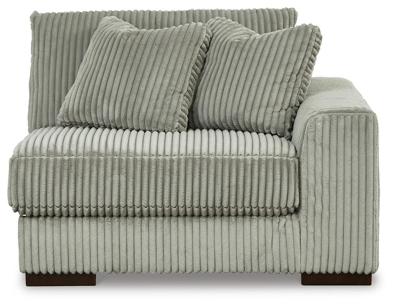 Ashley Furniture Lindyn sectional with chaise, beige fabric, modern design, showing the head-on view of the sectional and chaise.