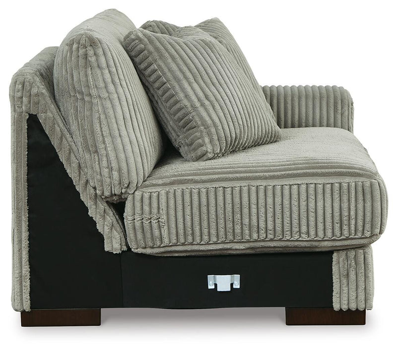 Ashley Furniture Lindyn sectional with chaise, featuring plush fabric, modern design, and comfortable seating arrangement.