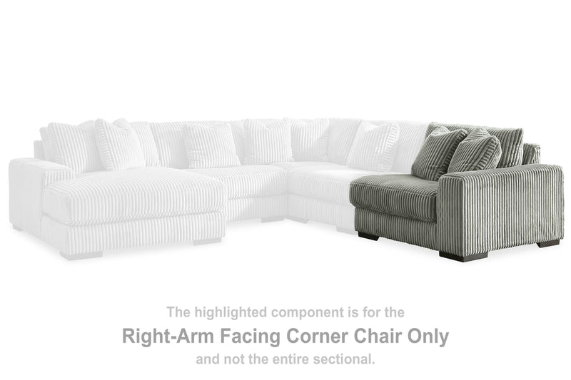 Ashley Furniture Lindyn sectional with chaise in beige fabric, featuring plush cushions and a modern design.