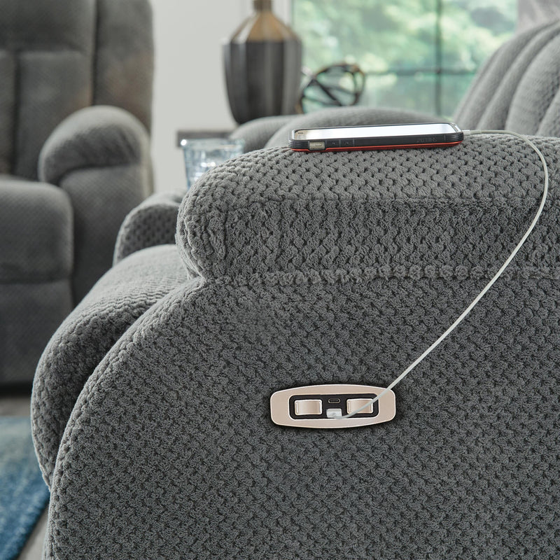 Ashley Furniture Observation Power Reclining Loveseat with Console, featuring USB ports and plush cushioned seating.