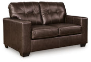 Ashley Furniture Santorine loveseat shown from an angle, featuring plush fabric upholstery and contemporary design.