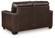 Ashley Furniture Santorine loveseat with plush fabric and wooden legs, shown from the back with a cozy, modern design.