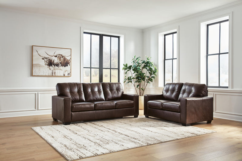 Ashley Furniture Santorine living room set featuring a sofa and armchair with neutral upholstery and modern design.