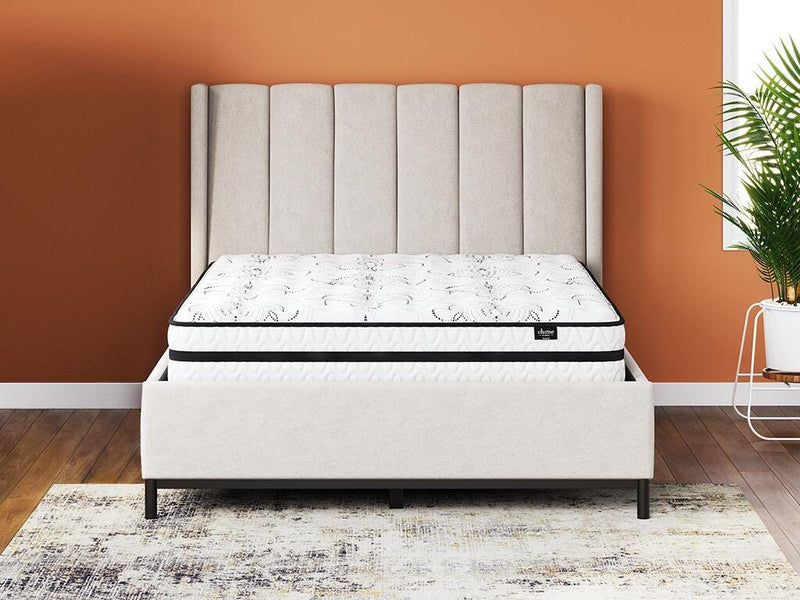 Ashley Furniture Chime 10-inch hybrid mattress in a box with layered foam and coil construction, shown rolled in packaging.