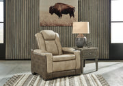 Ashley Furniture Next-Gen DuraPella power recliner with plush cushioning and built-in controls, shown in a closed position.