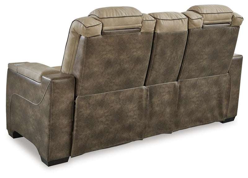 Ashley Furniture Next-Gen DuraPella power reclining loveseat with console, featuring plush cushions and built-in cup holders.
