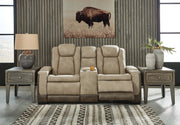 Ashley Furniture Next-Gen DuraPella power reclining loveseat with built-in console, featuring plush cushions and modern design.