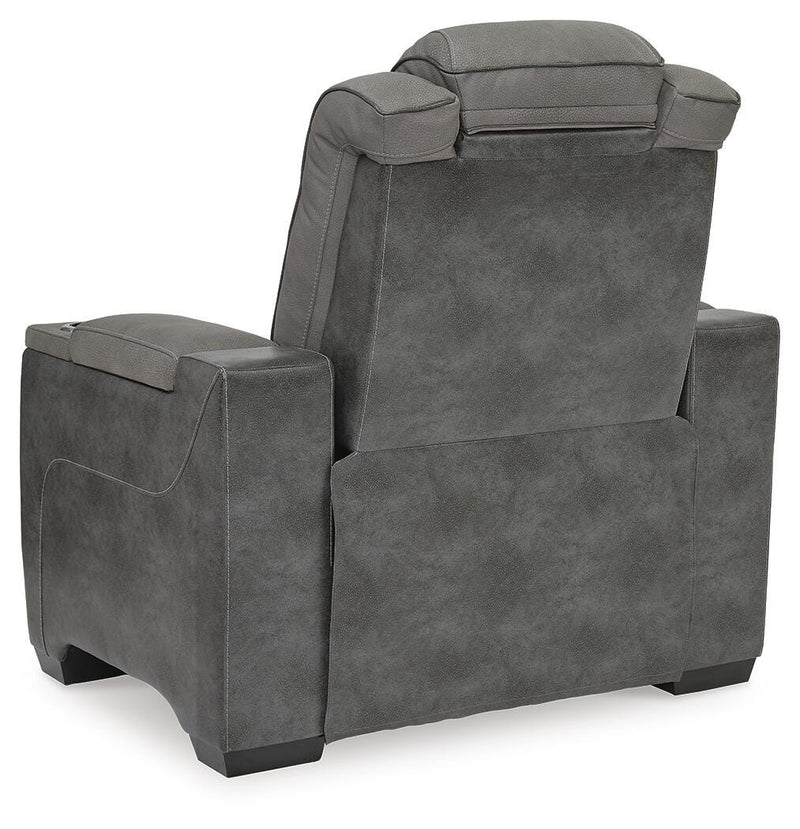 Ashley Furniture Next-Gen DuraPella Power Recliner with plush fabric and built-in recline mechanism, shown from the back with detailed stitching.