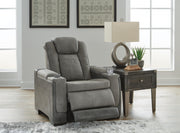 Open Next-Gen DuraPella power recliner by Ashley Furniture showing plush cushioned seat and backrest in dark upholstery.