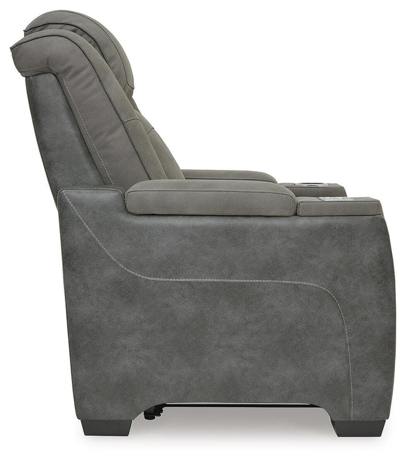 Ashley Furniture Next-Gen DuraPella power recliner with plush upholstery and padded armrests, shown from the side view.