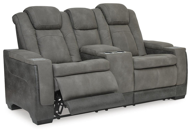 Ashley Furniture Next-Gen DuraPella power reclining loveseat with console, shown from an angled open view showcasing plush seating.