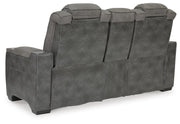 Ashley Furniture Next-Gen DuraPella power reclining loveseat with console, featuring plush upholstery and built-in cup holders.