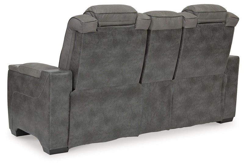 Ashley Furniture Next-Gen DuraPella power reclining loveseat with console, featuring plush upholstery and built-in cup holders.