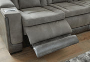 Ashley Furniture Next-Gen DuraPella living room set with plush sofas and armchairs arranged in a modern, cozy living space.