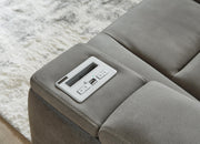 Ashley Furniture Next-Gen DuraPella power reclining loveseat with console, featuring plush upholstery and built-in cup holders.