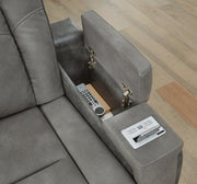 Ashley Furniture Next-Gen DuraPella Power Recliner with storage arm and plush cushioning, showcasing its modern design and comfortable features.