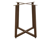 Round Tulum dining table by International Furniture Direct with a rustic wood finish and sturdy legs in a natural setting.