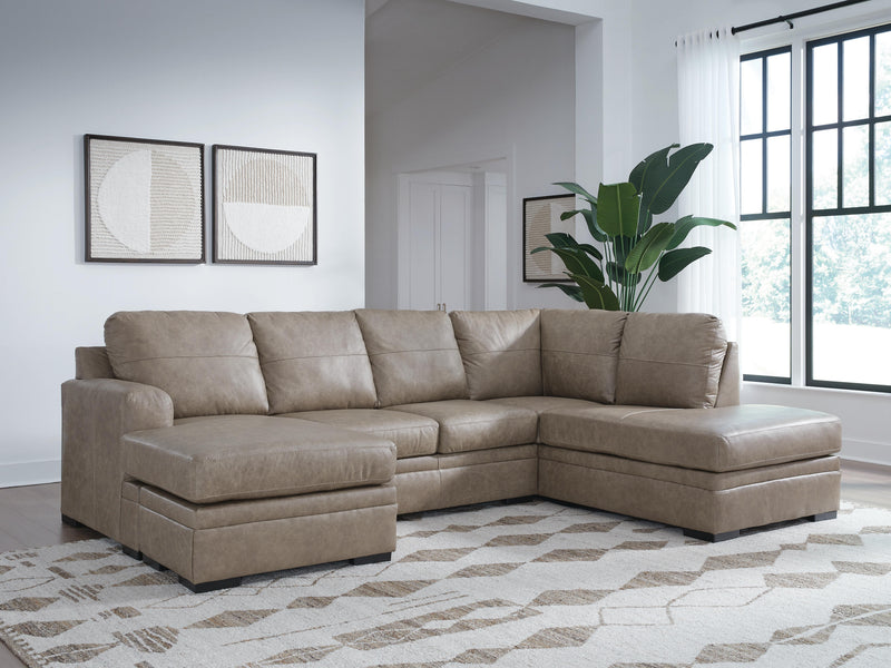 Ashley Furniture Amuleto sectional sofa with chaise, featuring plush cushions and modern design in a cozy living room setting.