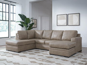 Ashley Furniture Amuleto sectional with chaise, featuring plush upholstered cushions and a modern design in a cozy living room setting.