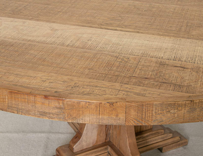 Round Marquez dining table by International Furniture Direct featuring a wooden surface and sturdy legs for a stylish dining space.
