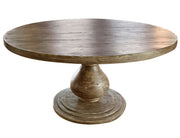 Round dining table from International Furniture Direct's Bonanza collection, featuring a polished wood surface and sturdy legs.