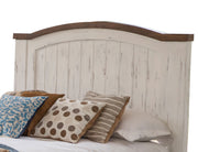 White Queen bed from International Furniture Direct with a classic headboard and sleek design, set against a neutral bedroom background.