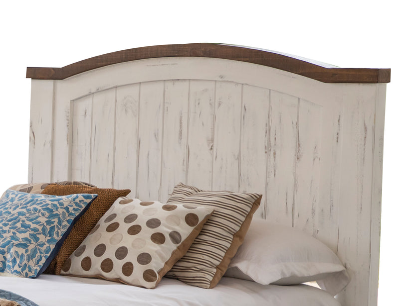 White Queen bed from International Furniture Direct with a classic headboard and sleek design, set against a neutral bedroom background.