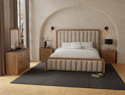 Upholstered king bed from International Furniture Direct with a plush fabric headboard and wooden frame, shown in a bedroom setting.