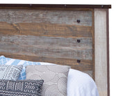 Antique King Bed by International Furniture Direct featuring carved wood details and classic design in a rustic finish.