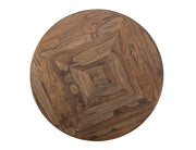 Balam round dining table by International Furniture Direct, showcasing wooden surface and sturdy legs in a well-lit dining room setting.