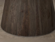 Black Balam round dining table by International Furniture Direct with a smooth wooden surface and sturdy legs.