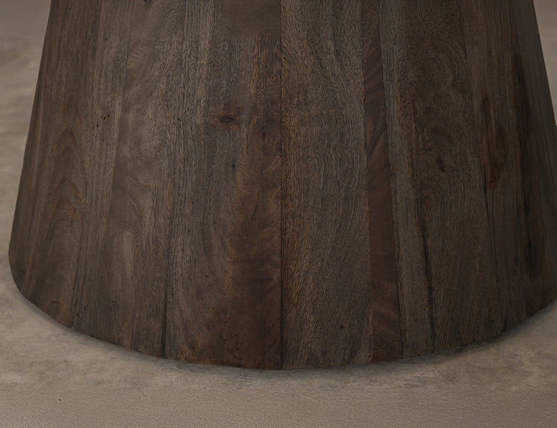 Black Balam round dining table by International Furniture Direct with a smooth wooden surface and sturdy legs.