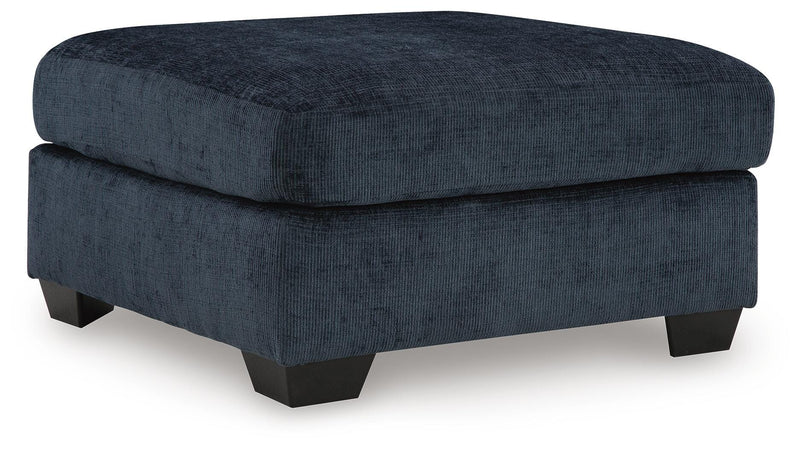 Ashley Furniture Aviemore oversized accent ottoman in neutral fabric, showing its large, plush surface and stylish design.
